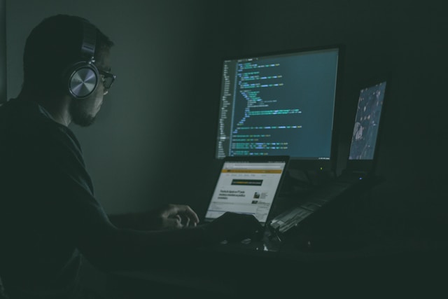 man sitting at the computer and working